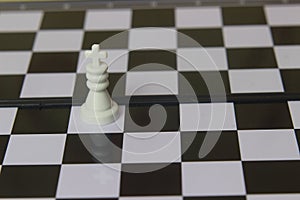 Simple Photo illustration for War, battle or politic situation concept, the winner, plastic magnetic small chess, critical