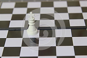 Simple Photo illustration for War, battle or politic situation concept, the winner, plastic magnetic small chess, critical