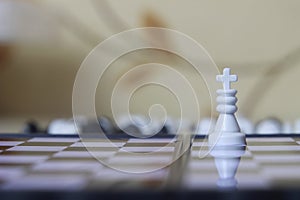 Simple Photo illustration for War, battle or politic situation concept, the winner, plastic magnetic small chess, critical