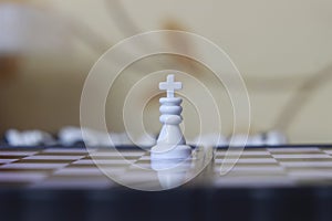 Simple Photo illustration for War, battle or politic situation concept, the winner, plastic magnetic small chess, critical