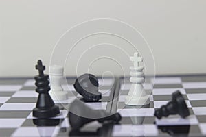 Simple Photo illustration for War, battle or politic situation concept, the winner, plastic magnetic small chess, critical