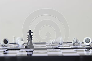 Simple Photo illustration for War, battle or politic situation concept, the winner, plastic magnetic small chess, critical