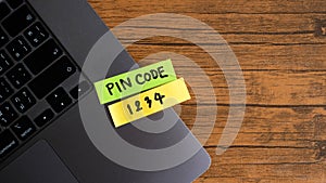 Simple pin code written post it on laptop keyboard.