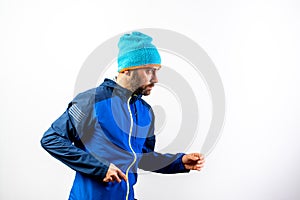 Simple portrait and white background, of a mountaineer man ready to start a challenge in nature