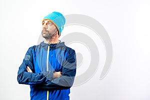 Simple portrait and white background, of a mountaineer man ready to start a challenge in nature