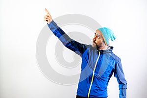 Simple portrait and white background, of a mountaineer man ready to start a challenge in nature