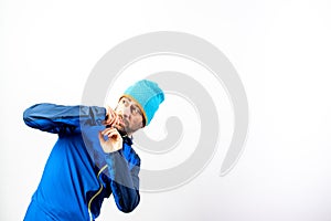 Simple portrait and white background of mountaineer with winter hat with gesture of surprise before a danger