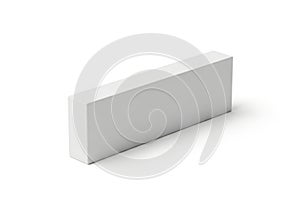 Simple rectangular gray block placed on a plain background surface