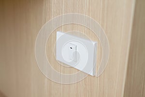 Simple rectangular white light switch.