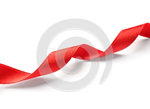 Simple red ribbon on white background. Festive