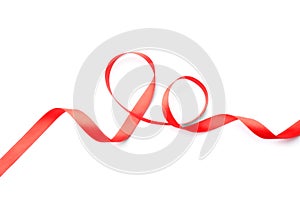 Simple red ribbon on white background, top view. Festive