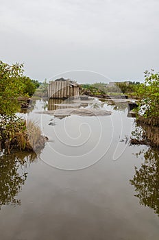 Simple reed mat homes of poor fishermen in wetlands of Benin