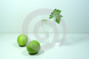 Simple refreshments. Two green jujubes and a glass of water. Diet meal