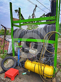 A simple repair shop to patch tires and inflate vehicle tires.