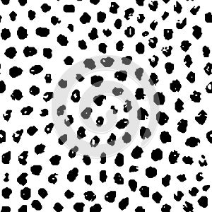 Simple seamless pattern in polka dot style. Black and white print for textiles. Brush strokes drawn in ink by hand. Vector