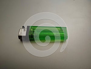 Close up of simple small green gas lighter