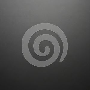 A simple, solid black textured background. The surface appears smooth, with subtle