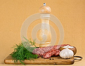 Simple still life with cut sausage