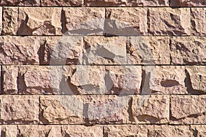 Simple stone wall. Masonry background with original pattern