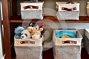 Simple storage baskets for toys on shelves for easy clean-up and kids access