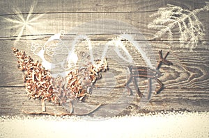 Simple symbols of Father Christmas sleigh arranged from sawdust