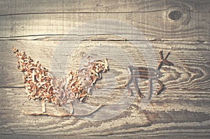 Simple symbols of Father Christmas sleigh arranged from sawdust