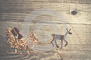 Simple symbols of Father Christmas sleigh arranged from sawdust