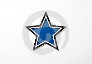 Is simple and symmetrical, emphasizing the geometric precision of the