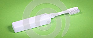 Simple toothbrush, isolated on green