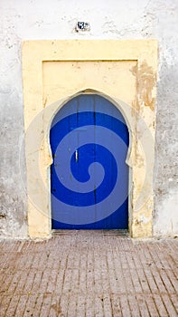Simple traditional blue Moroccan door, Essaouira, Morocco