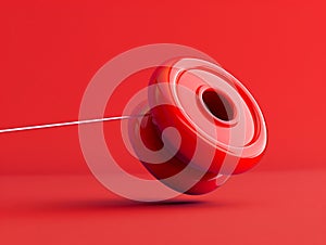 A simple, vibrant image of a yoyo at the peak of its string, symbolizing skill and precision photo
