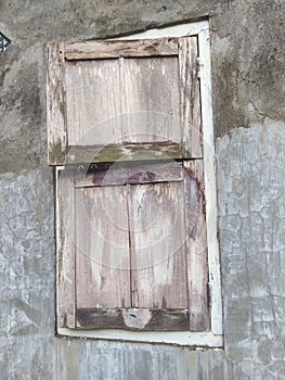 Simple village window structure. Wood , plaster and stone. Natural colours