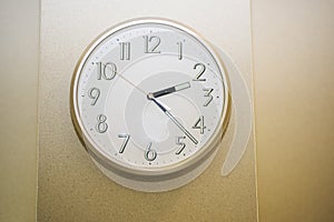 Simple wall clock. Wooden texture.