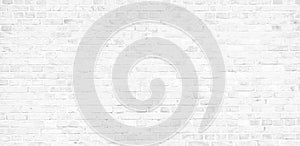 Simple white brick wall with light gray shades seamless pattern surface texture background in banner wide panorama photo