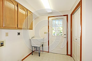 Simple white empty laundry room interior.