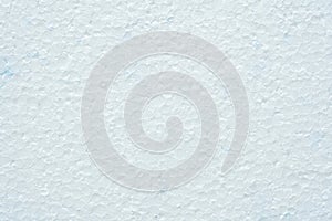 Simple white flat piece of styrofoam material structure background texture, seen from above, top view closeup detail shot, nobody