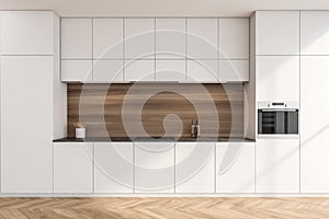 Simple white kitchen with wood look splashback