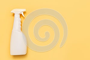Simple white plastic hand spray bottle on yellow background