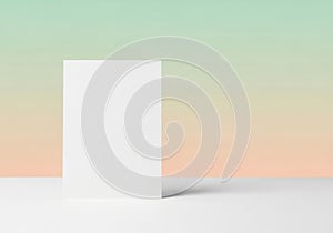 Minimalist white rectangular object casting a soft shadow on a gradient background