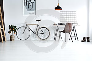 Simple, white room with bike