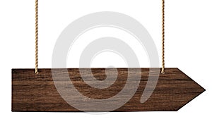 Simple wooden arrow signpost made of dark wood hanging on ropes