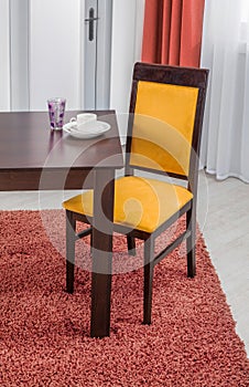 Simple wooden dinning table and chair in interior - studio ambient room