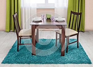 Simple wooden dinning table and chairs in interior - studio ambient room