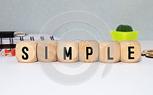 SIMPLE word made with building blocks isolated on white