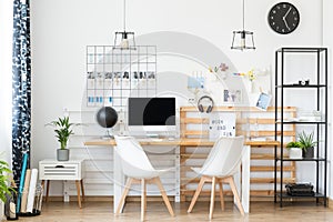 Simple workspace with wooden table