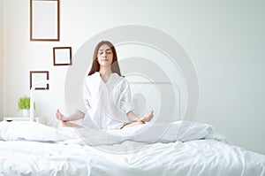 Simple yoga posture on the mattress