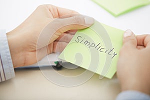 Simplicity text on adhesive note