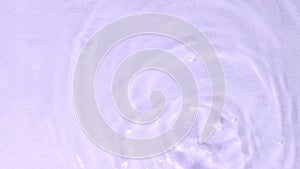 The simplicity of a water droplet and the ensuing ripples reflect the effectiveness of minimalist skincare. Connects to