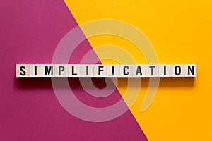 Simplification word concept on cubes photo