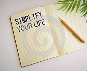 Simplify your life word written in notebook.Conceptual hand writing showing Simplify Your Life. Business photo text focused on